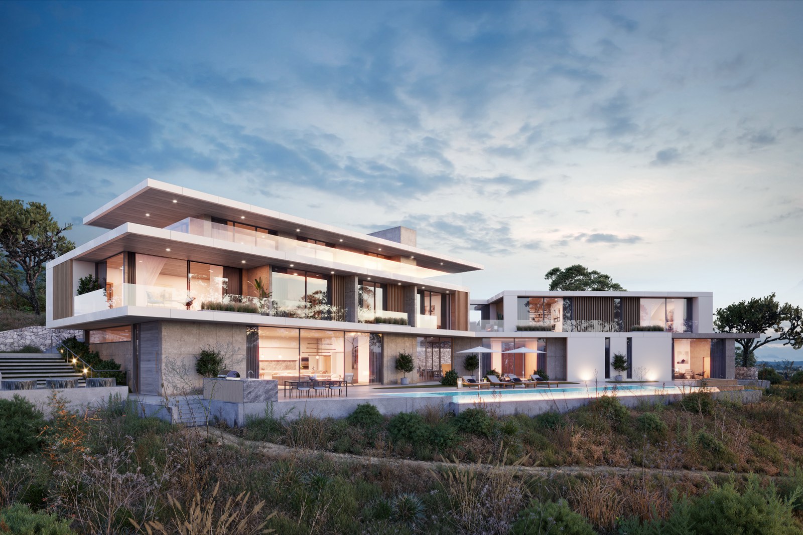A modern luxury villa at dusk with an illuminated pool terrace
